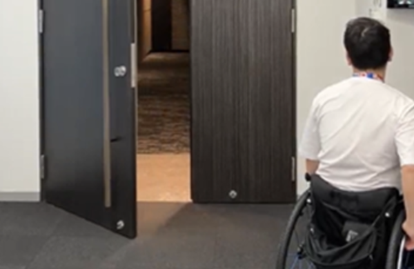 Man in wheelchair and door