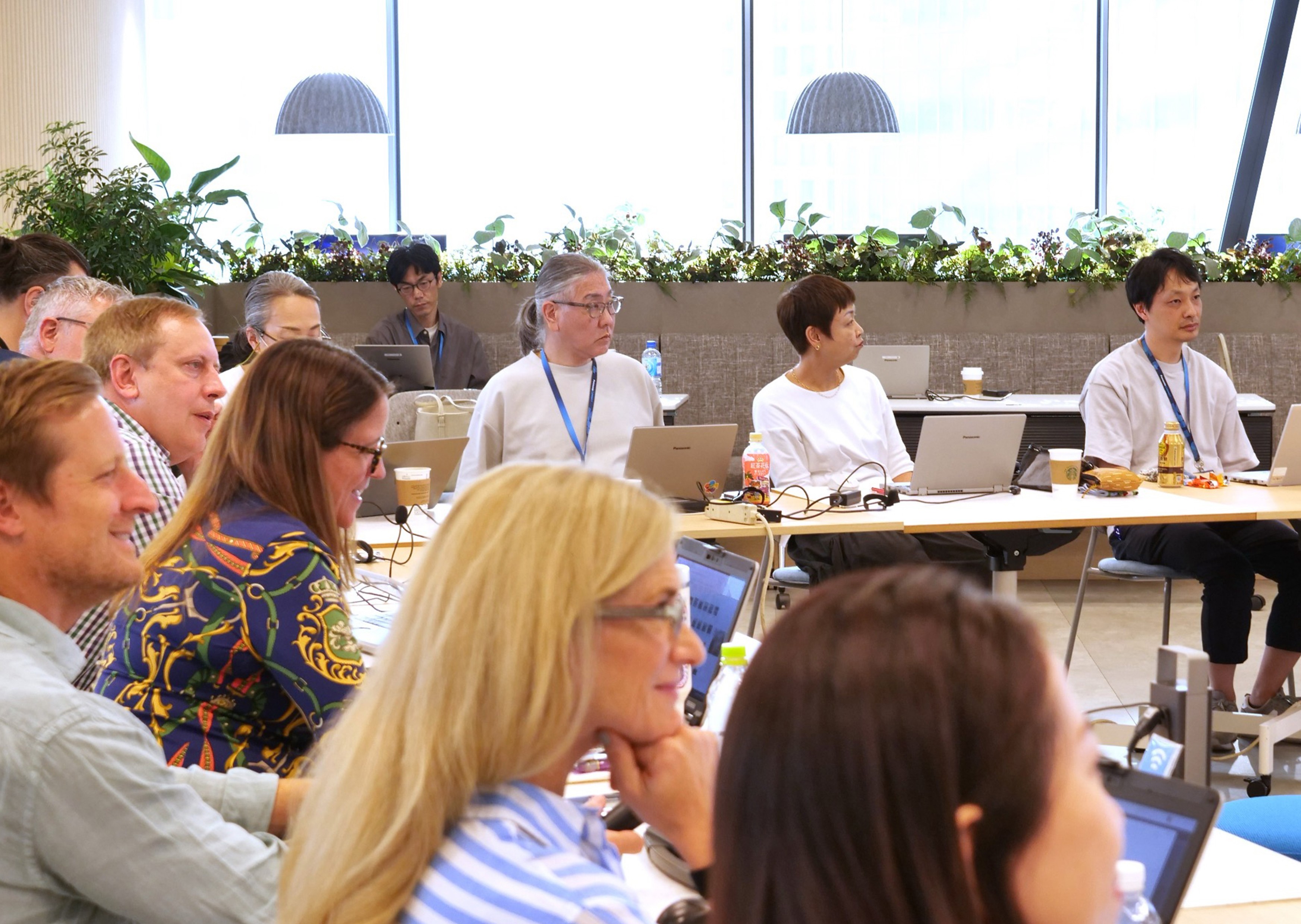 People of different nationalities discussing in a conference room