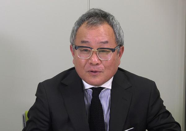 写真：購買部 課長 佐伯勝昭様