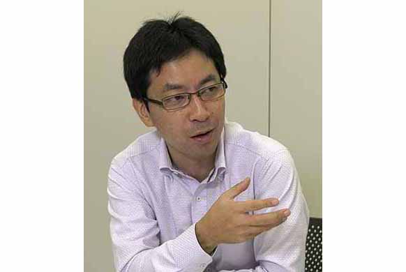 写真:RFID企画・統括・ 推進機能プロジェクト PJリーダー 佐藤 雅一 様