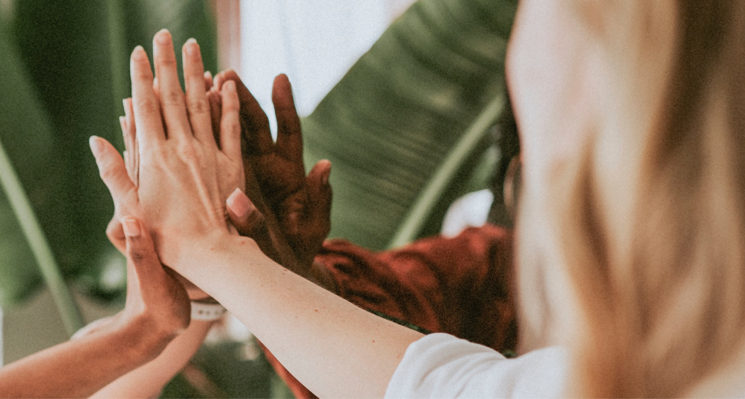 People of various races joining hands